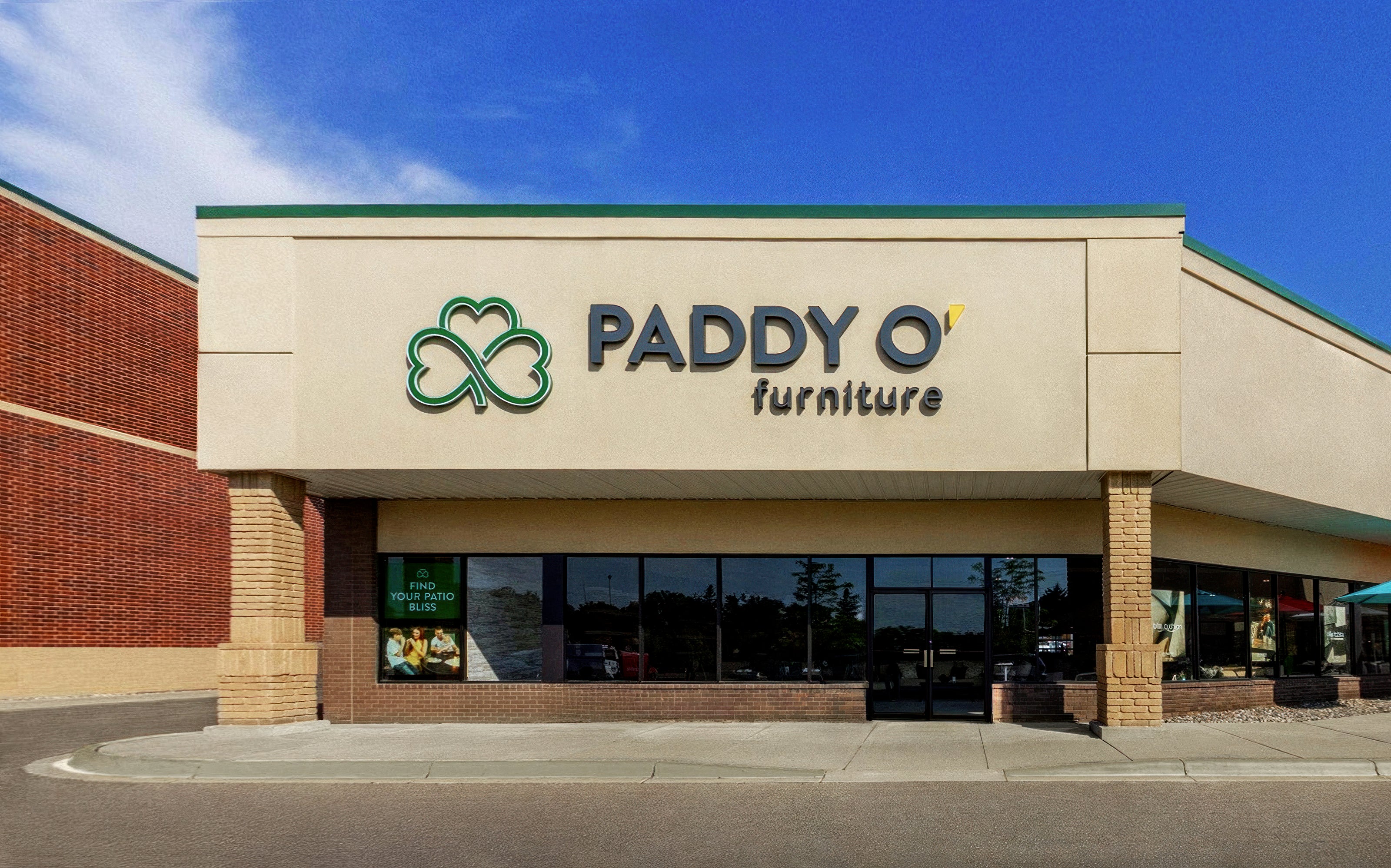 Eden Prairie Paddy O' Furniture store front with blue sky